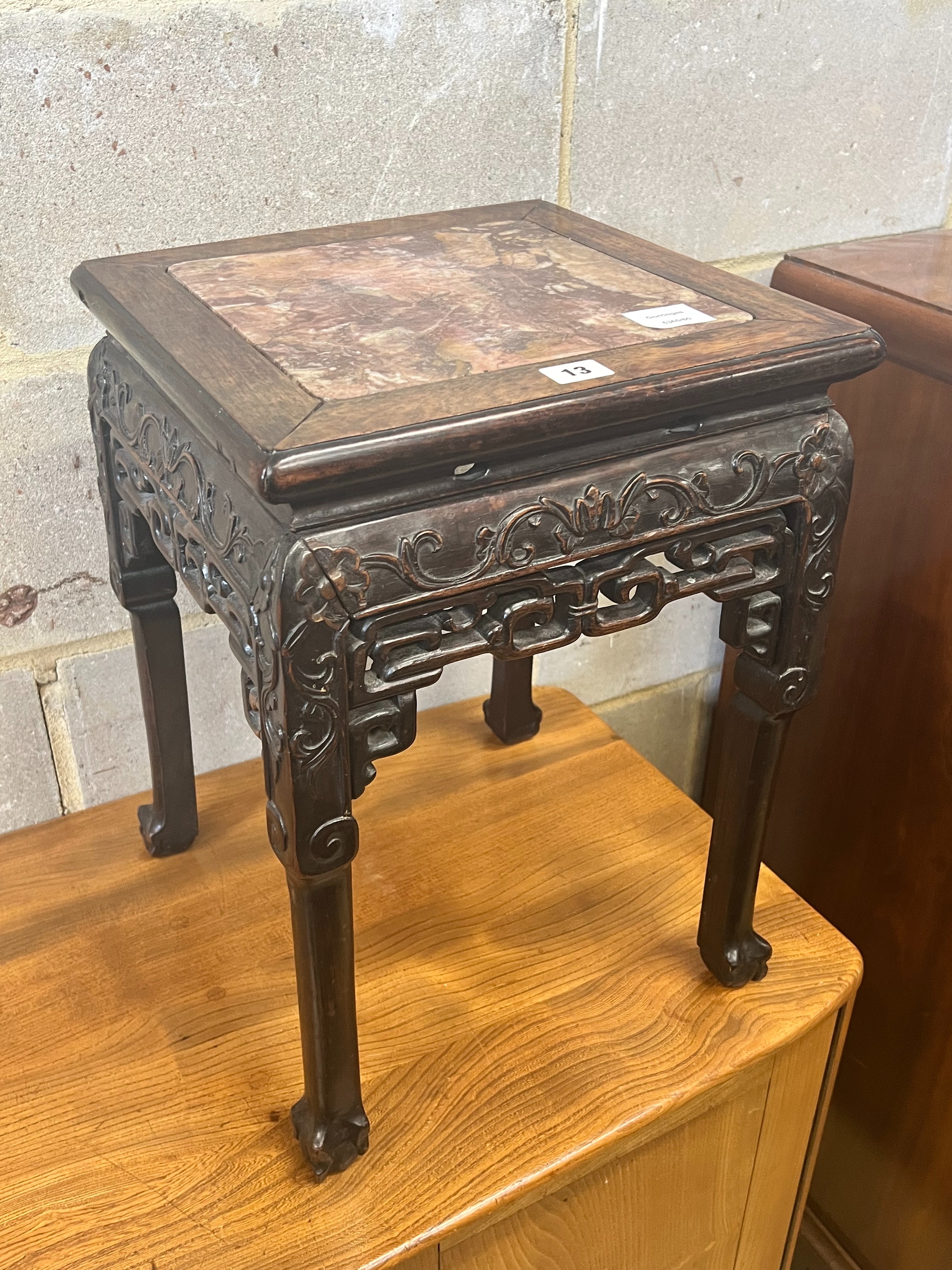 A Chinese marble topped carved hardwood jardiniere stand, width 35cm depth 35cm height 47cm